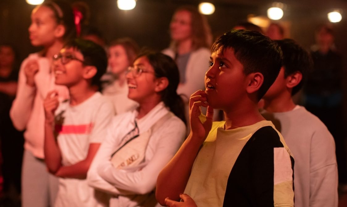 A group of children in an immersive theatre show