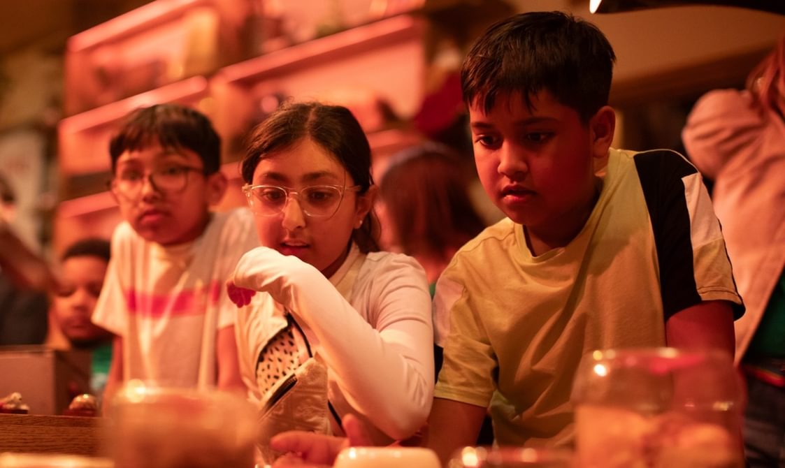 A group of children in an immersive theatre show